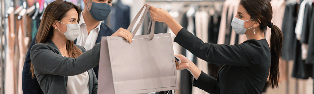 Consumer getting her shopping bag at the counter