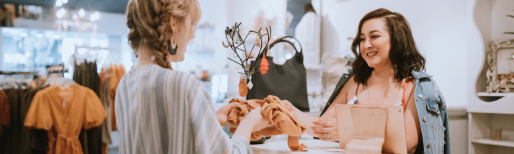 Retailer with customer at the counter