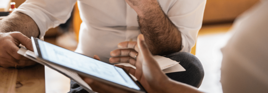 People looking at a tablet