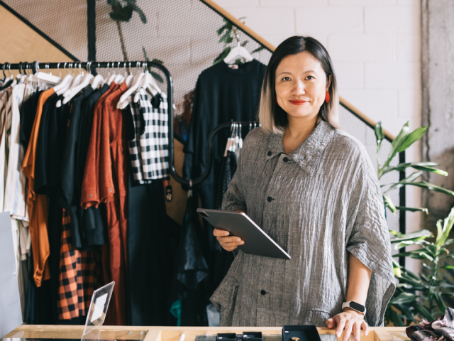 Retail associate using a tablet for clienteling, store technology, and customer relationship management.